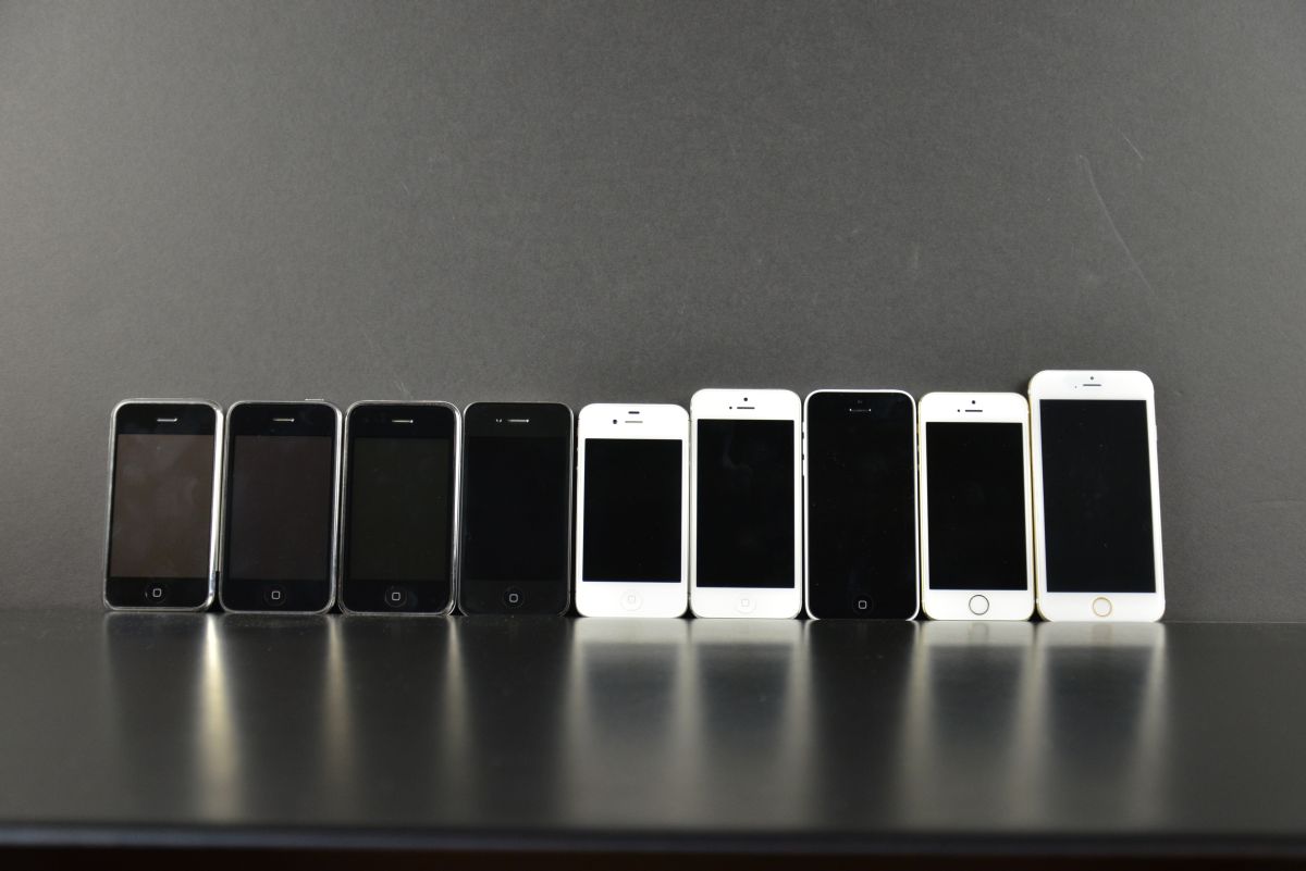 Front view of 8 generations of iPhone next to the fake model of iPhone 6